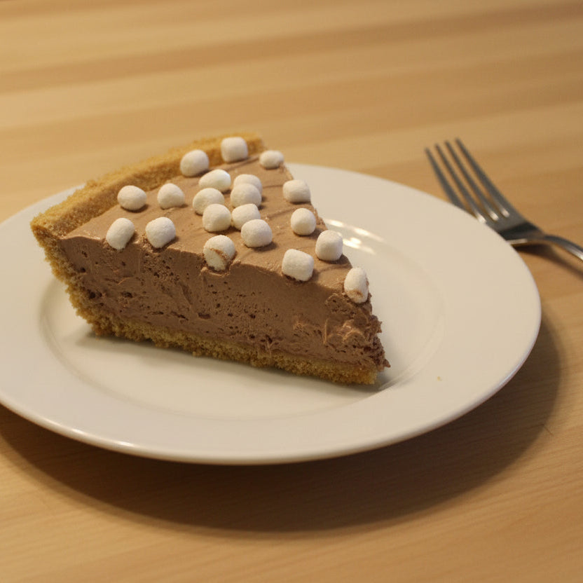 Slice of chocolate whipped pie with graham cracker crust from Sweet Peas